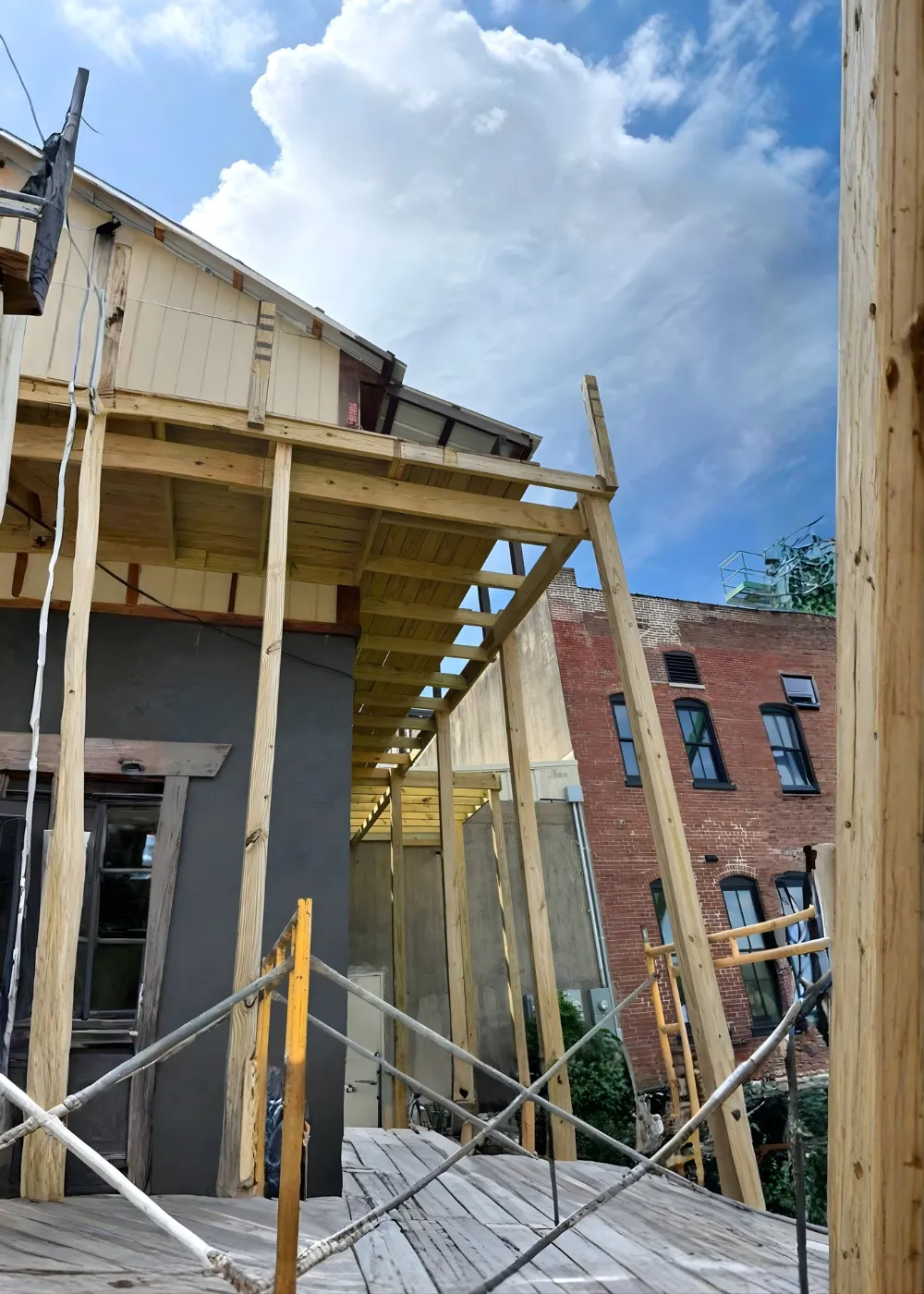 Deck framing and roof extension in progress