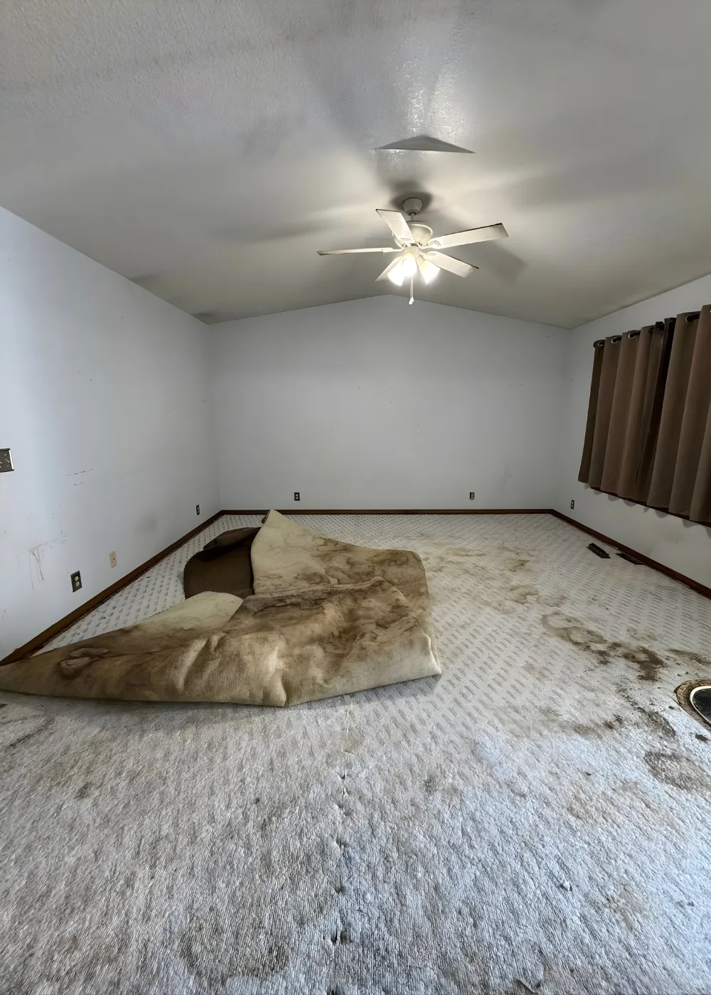 Living room before carpet removal